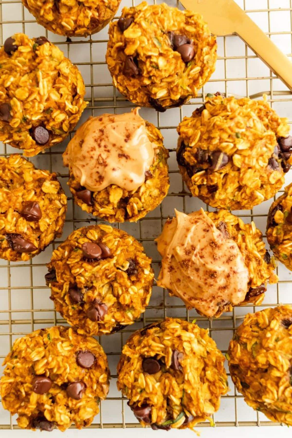 Crunchy pumpkin zucchini oat cups on a resting grid.