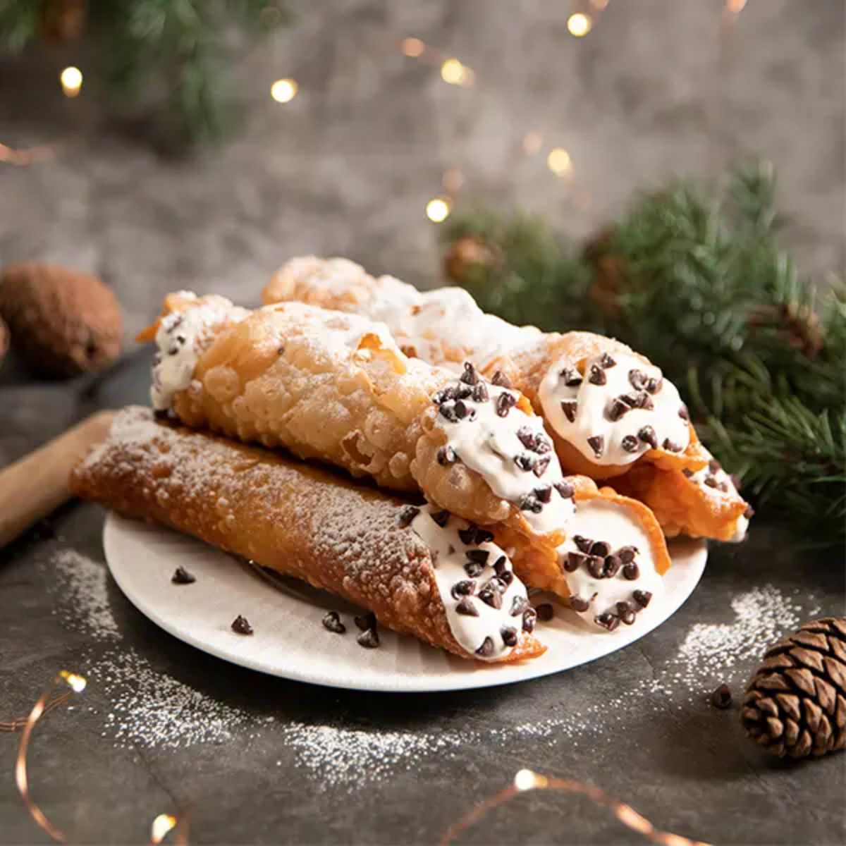 Crunchy homemade vegan cannoli on a white plate.