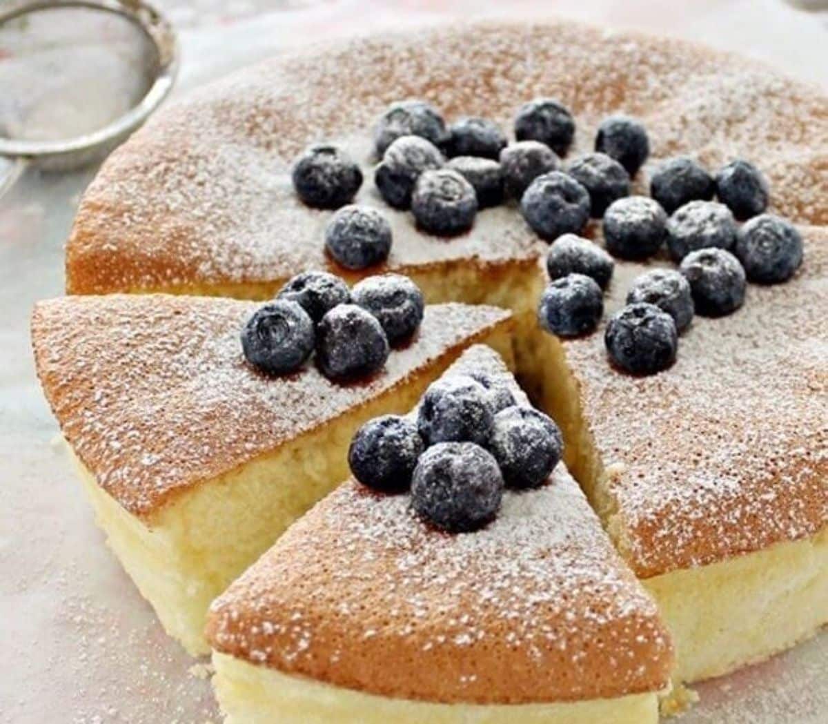 Sliced corn flour sponge cake on a countertop.