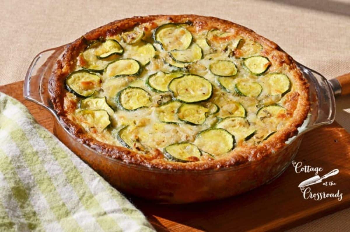 Tateful italian zucchini pie on a wooden tray.