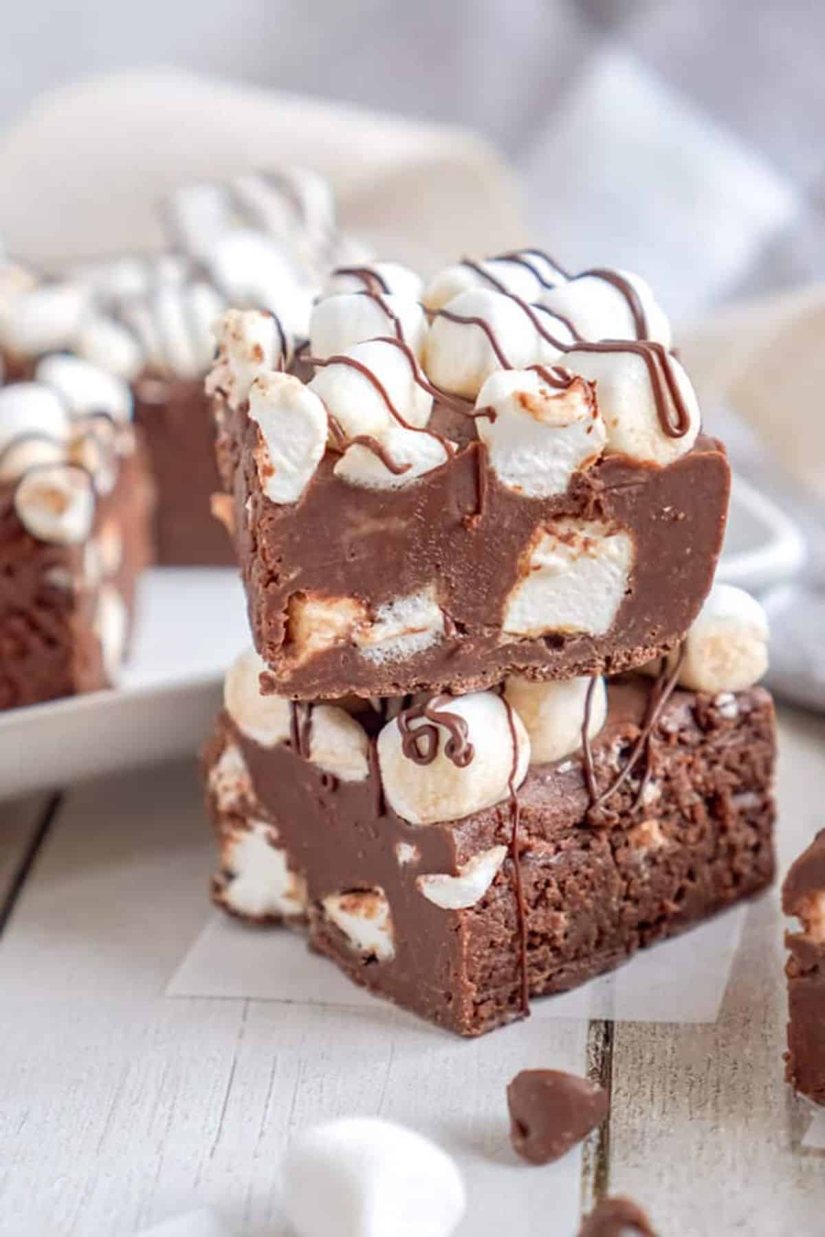 Mouth-watering hot chocolate fudge on a wooden table.