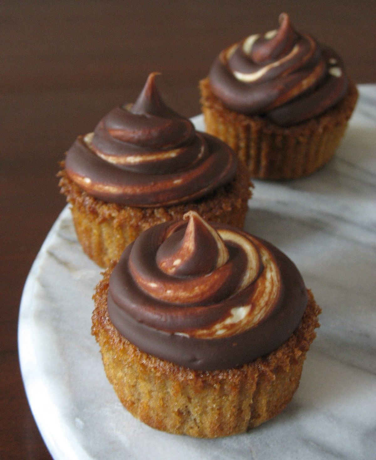 Delicious chestnut cupcakes on a tray.