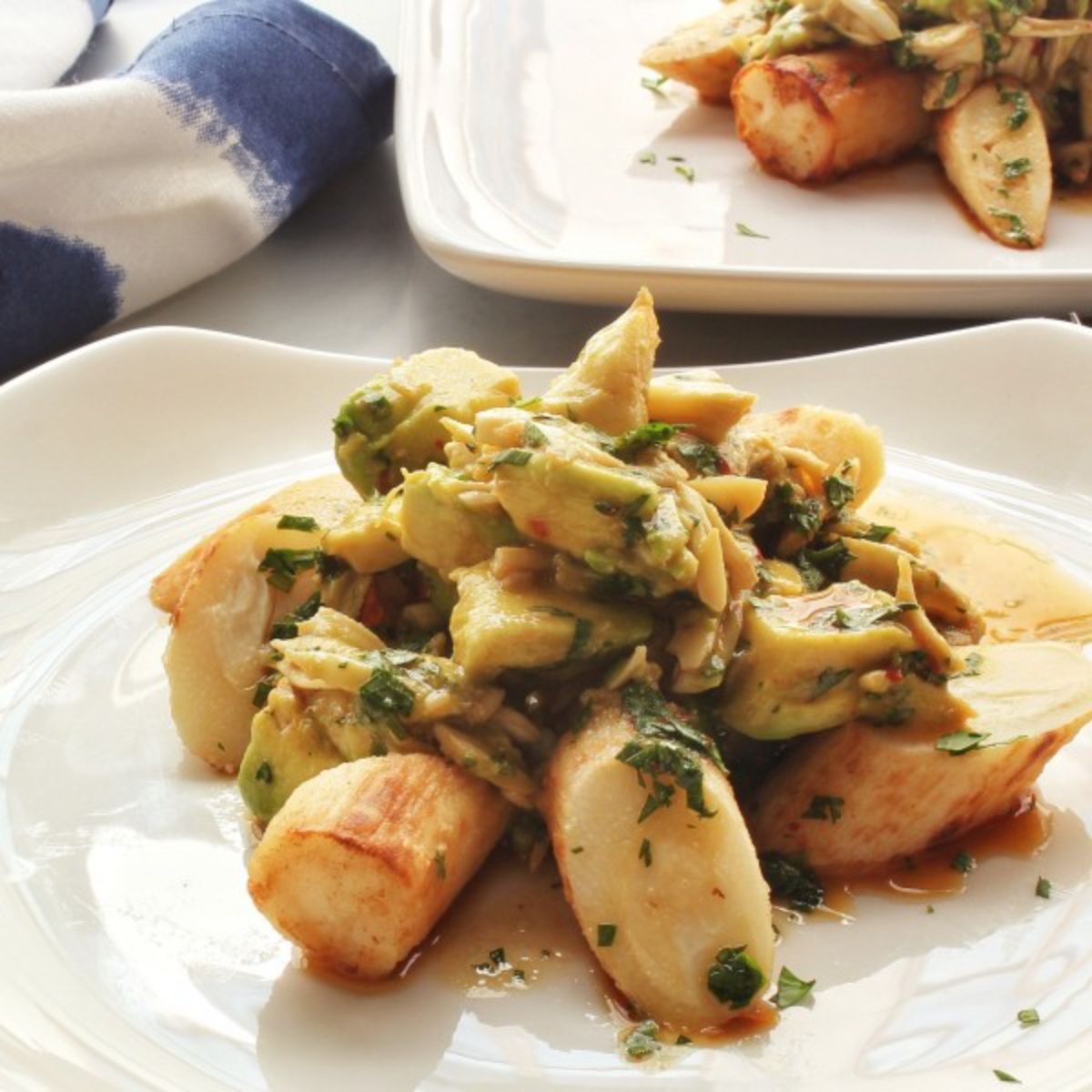 Tasty hearts of palm salad on a white tray.