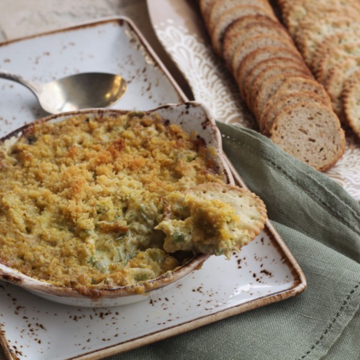 Delicious hot crab dip in a bowl.