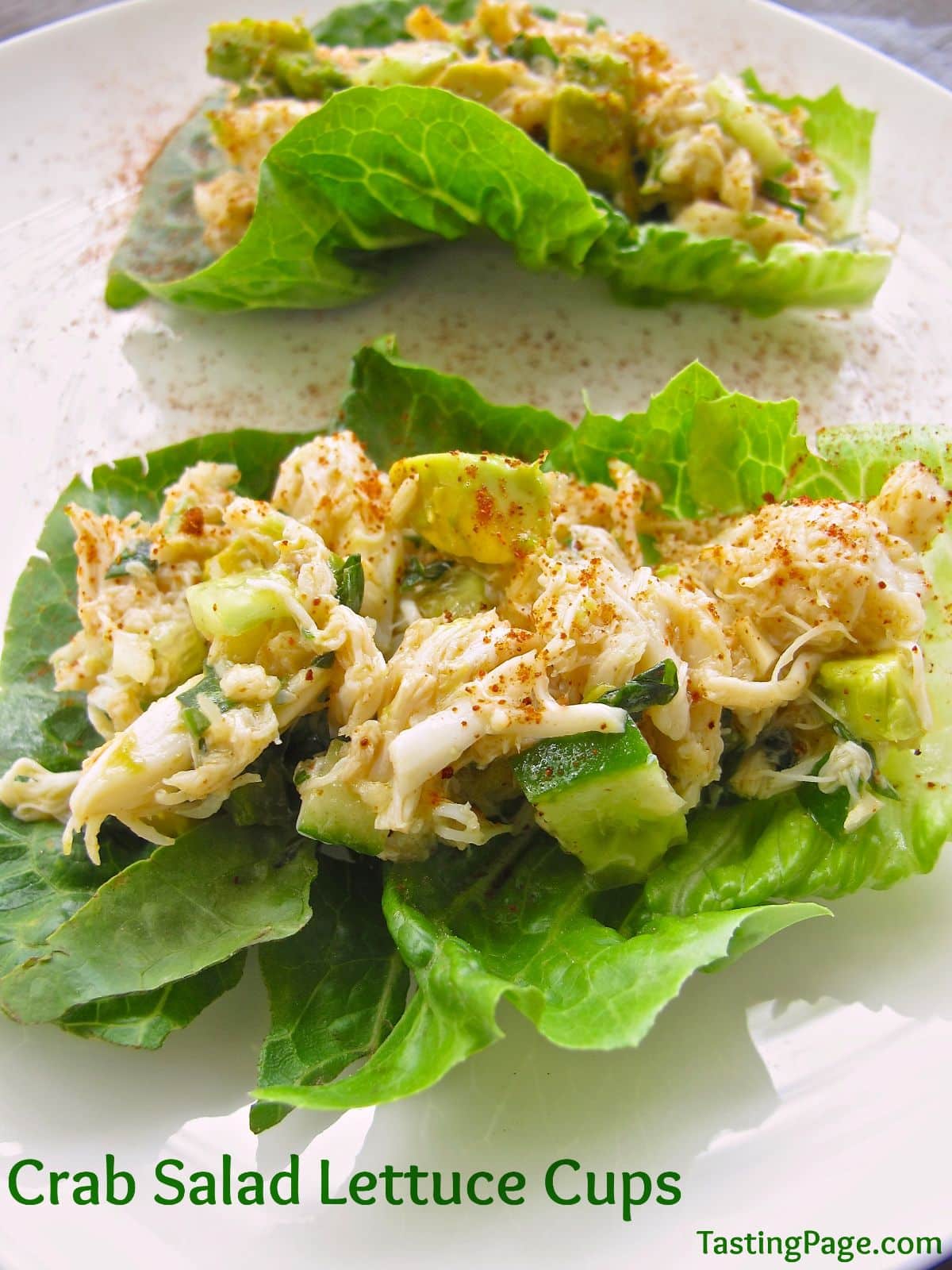 Healthy crab lettuce cups on a white tray.