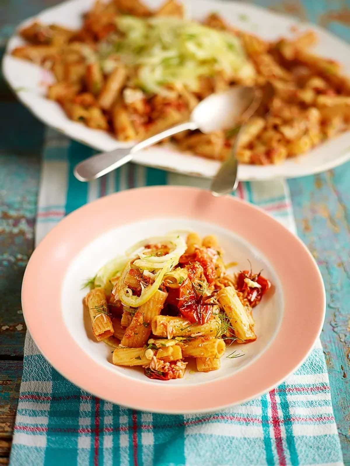 Healthy crab rigatoni on a small plate.