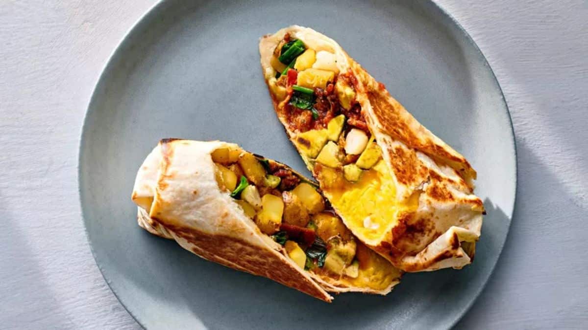 Flavorful breakfast-for-dinner burritos on a gray plate.