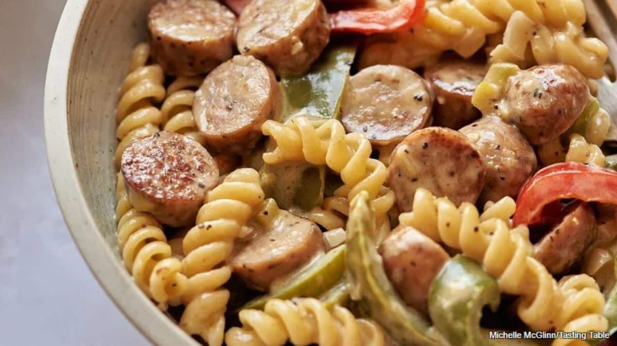 Tasteful chicken sausage and bell pepper pasta in a bowl.
