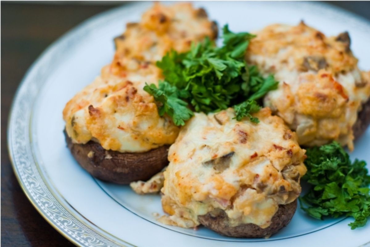 Scrumptious crab and shrimp stuffed mushrooms on a plate.