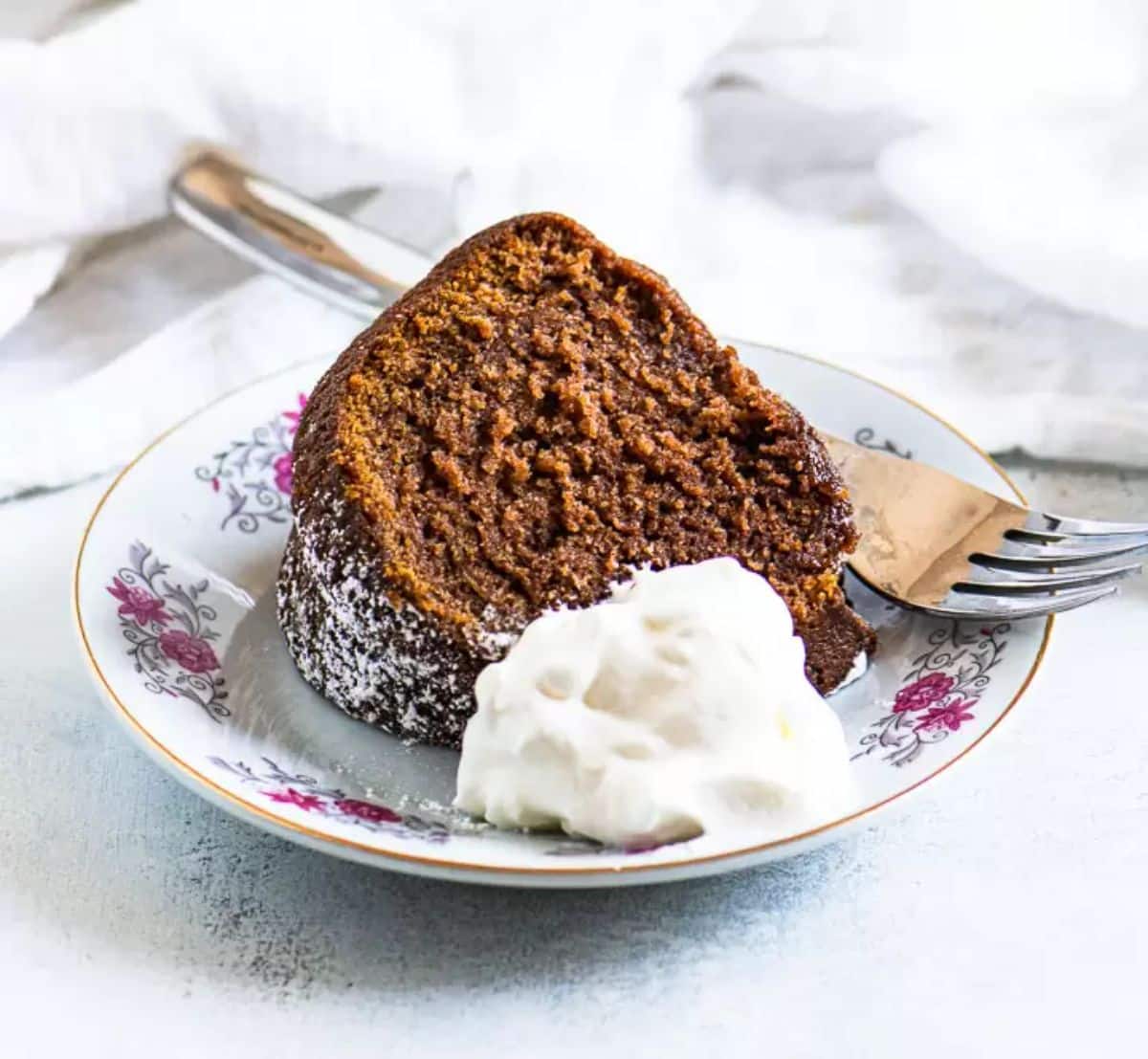 A piece of kahlua cakeon a plate with a fork.