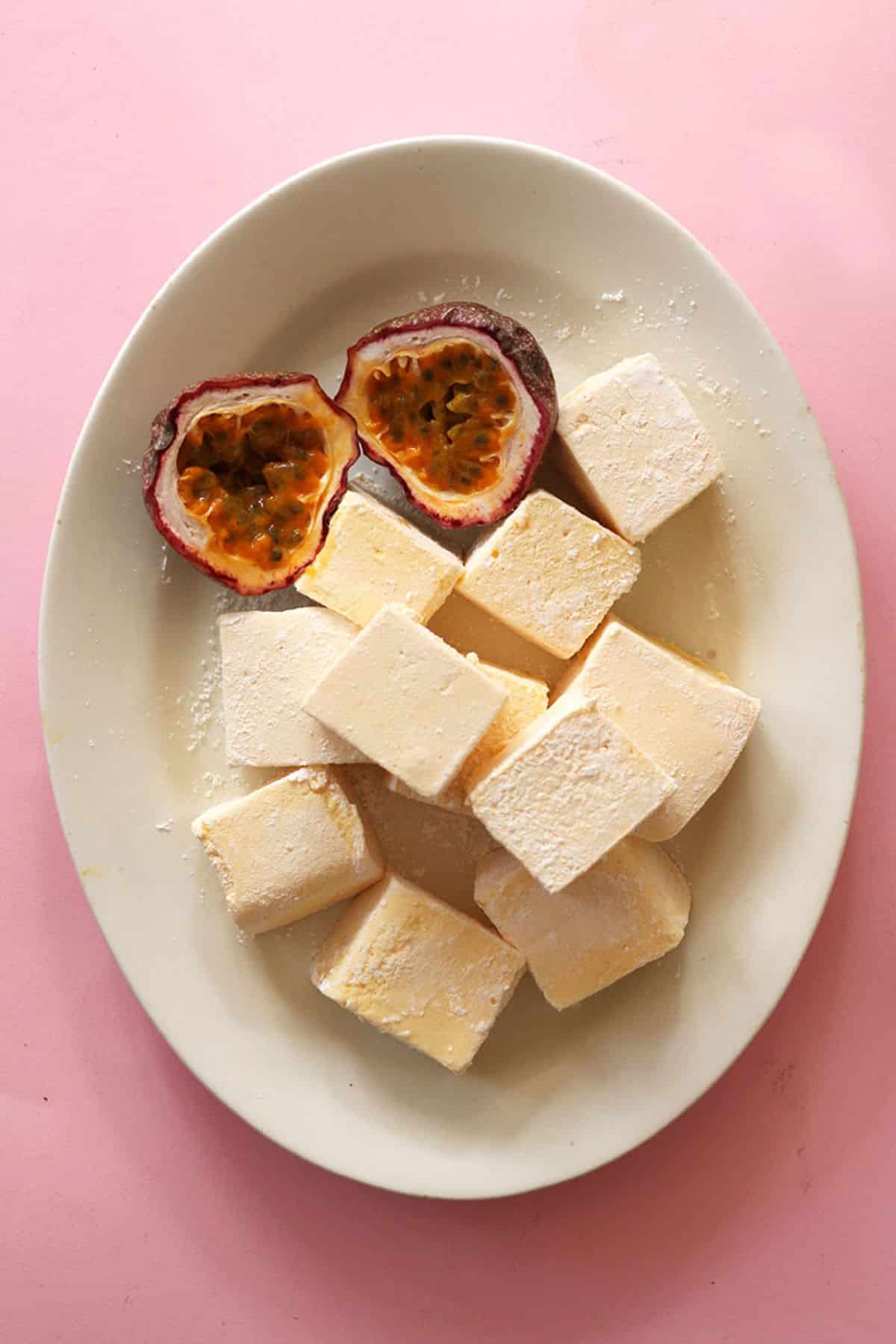Delicious passion fruit and vanilla marshmallows on a white tray.