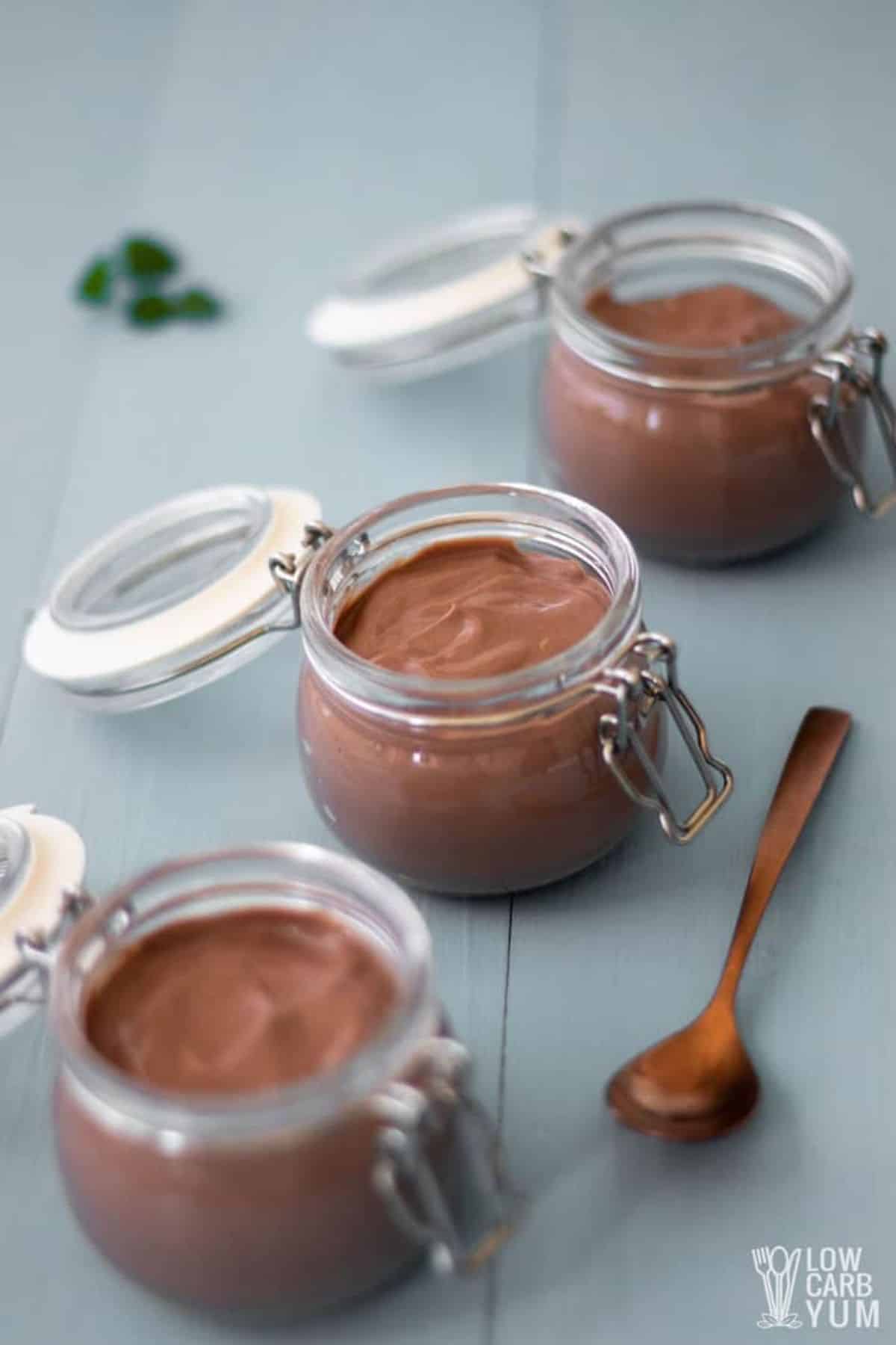 Creamy quick and easy chocolate tofu pudding dessert in glass jars.