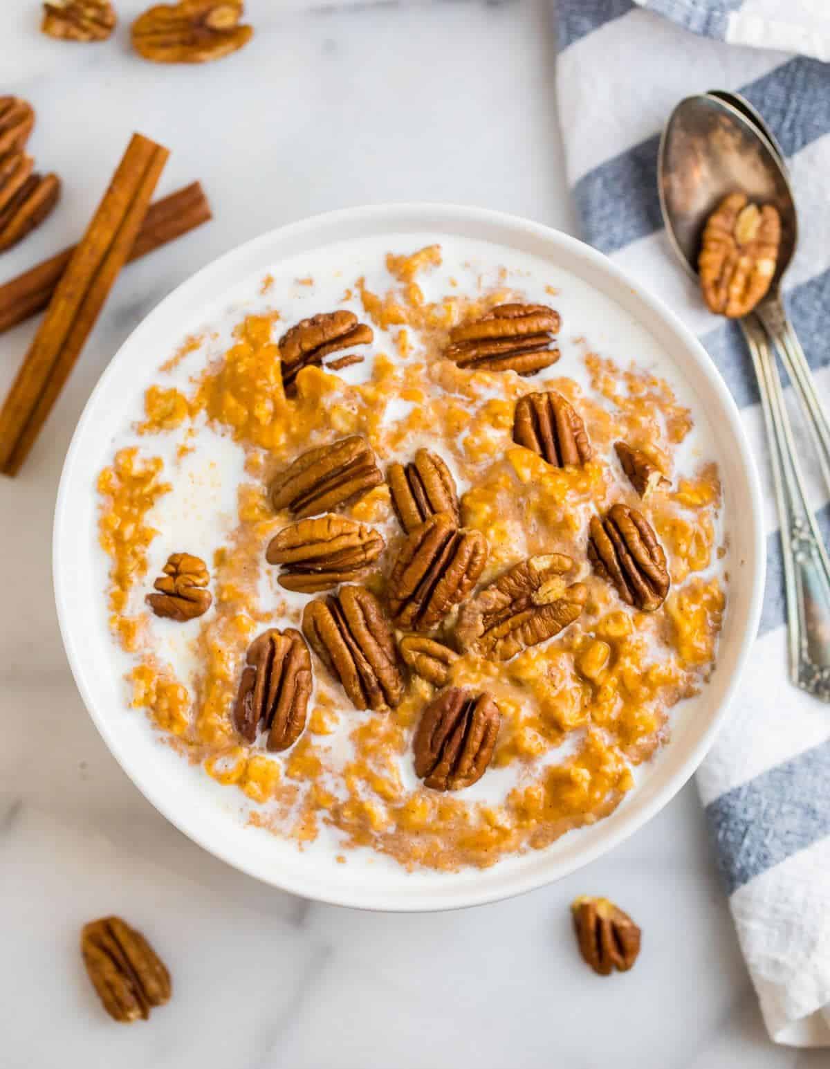 Healthy pumpkin oatmeal in a white bowl.