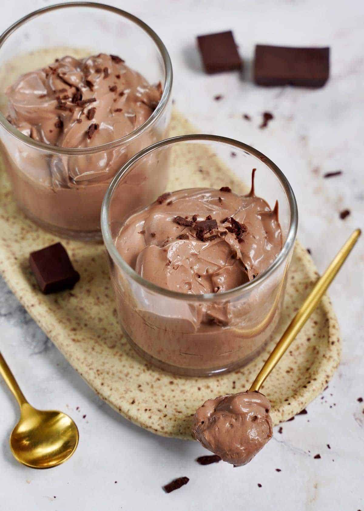 Mouth-watering vegan chocolate mousse in glass jars.