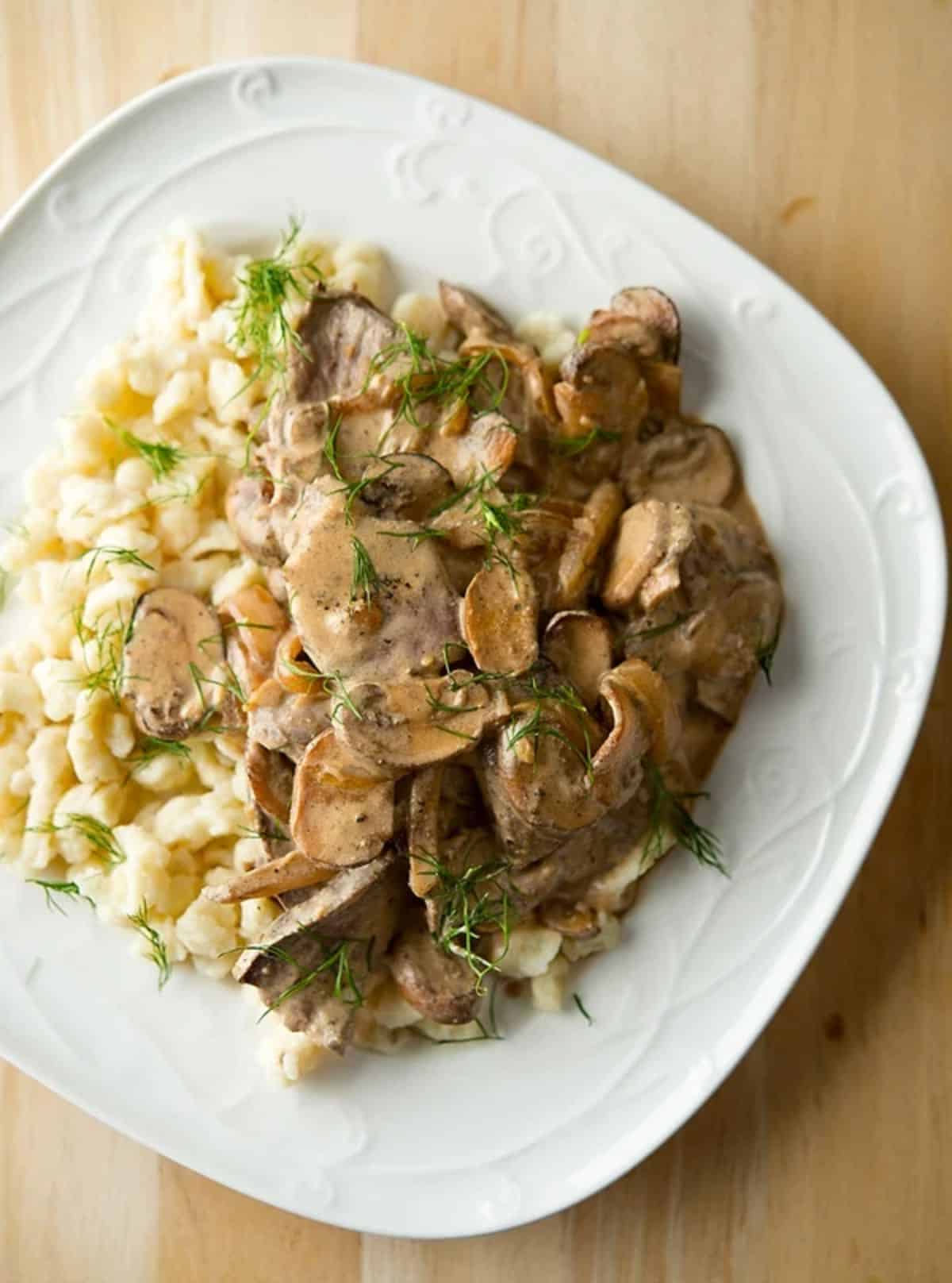 Delicious venison stroganoff on a white plate.