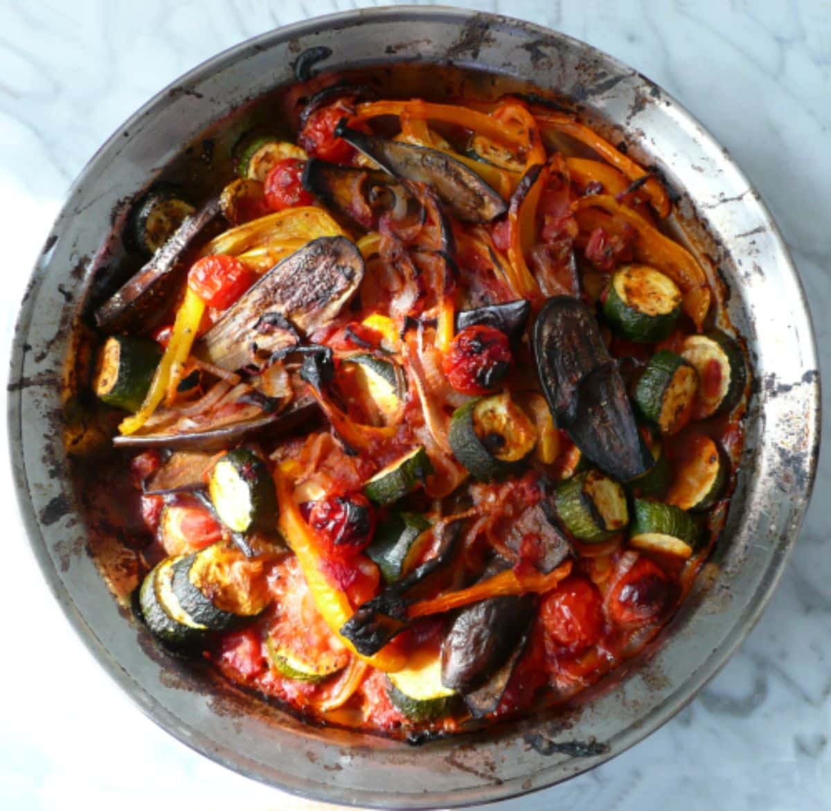 Scrumptious briam with baby eggplant in a bowl.