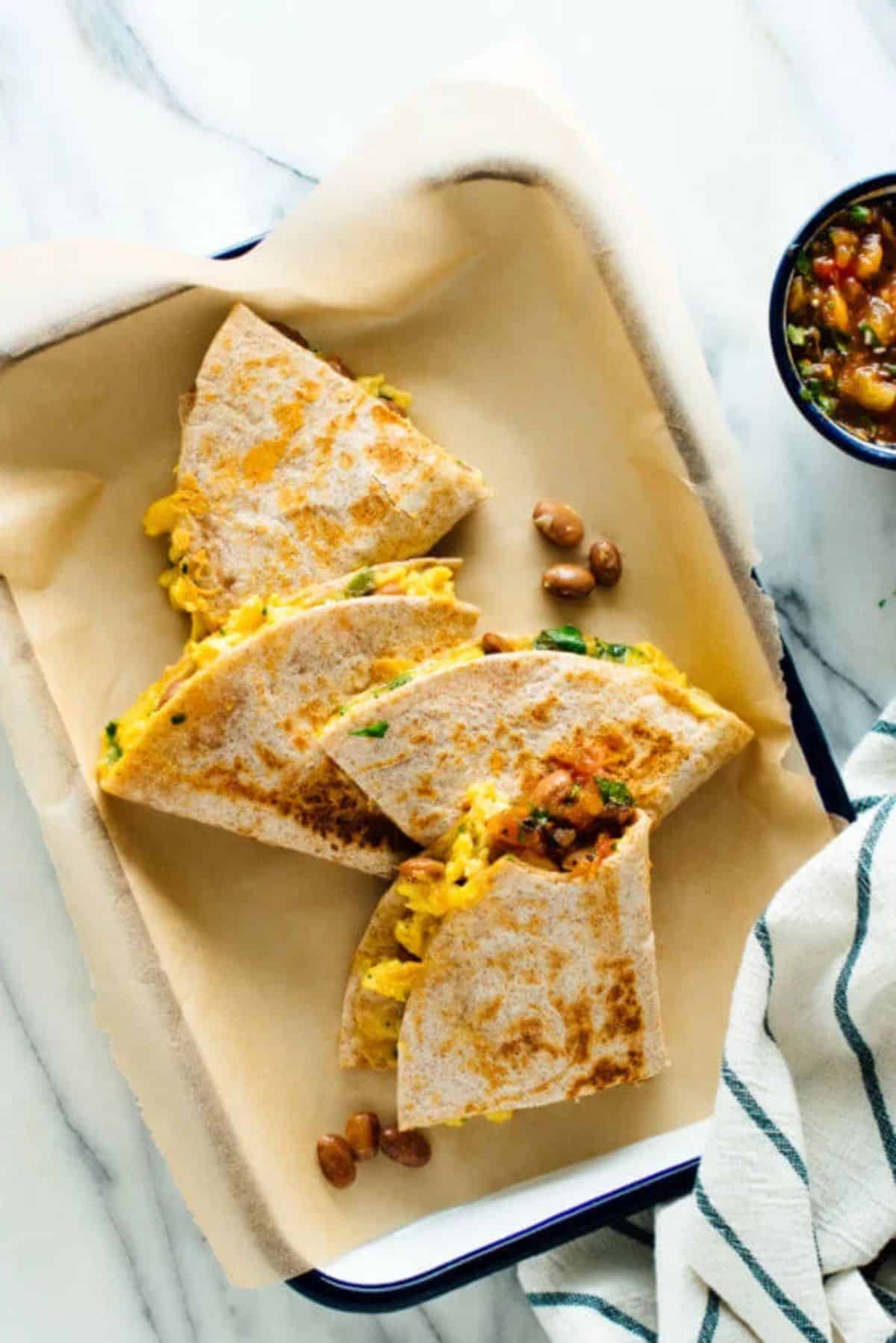 Crunchy breakfast quesadillas on a tray.