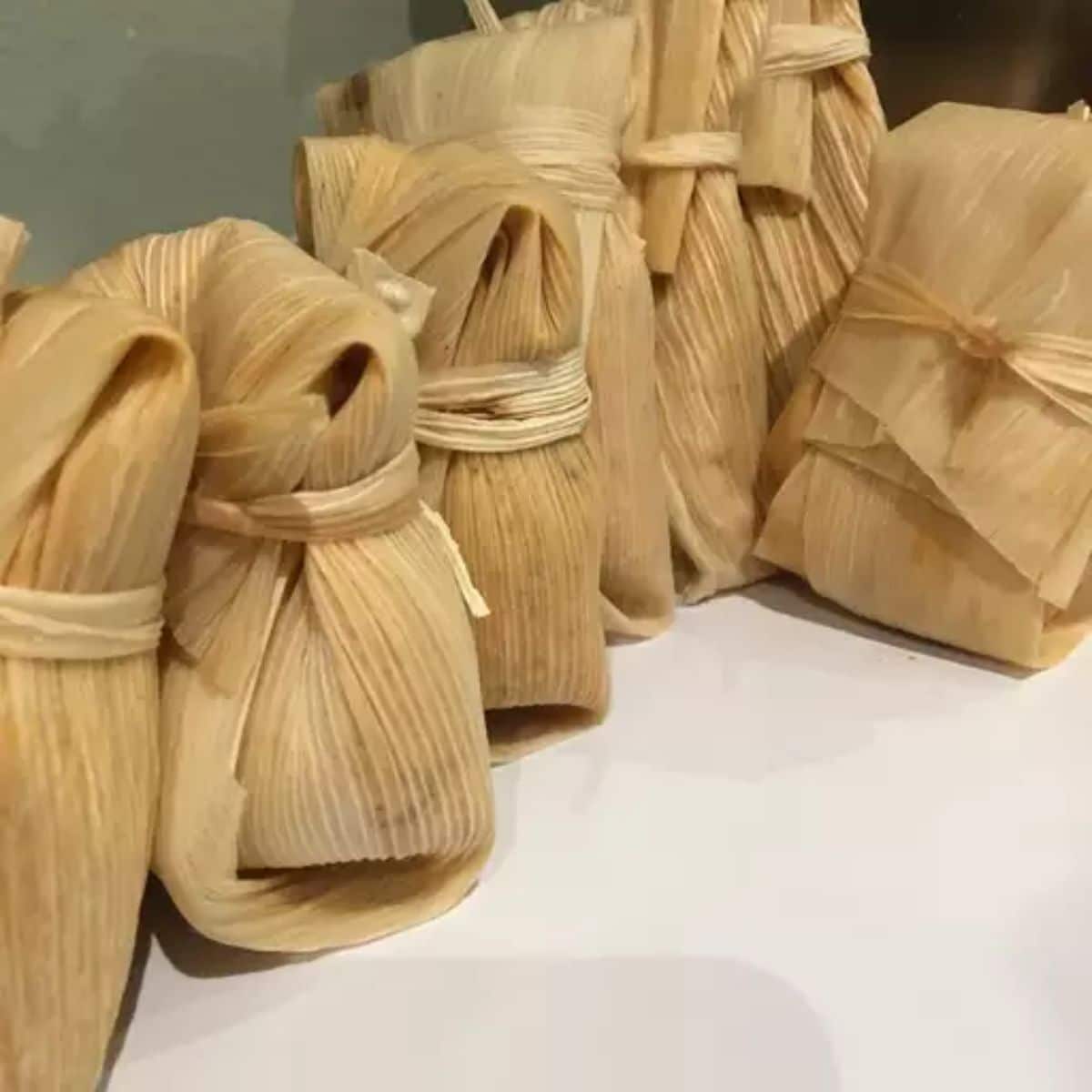 Beef tamales on a countertop.