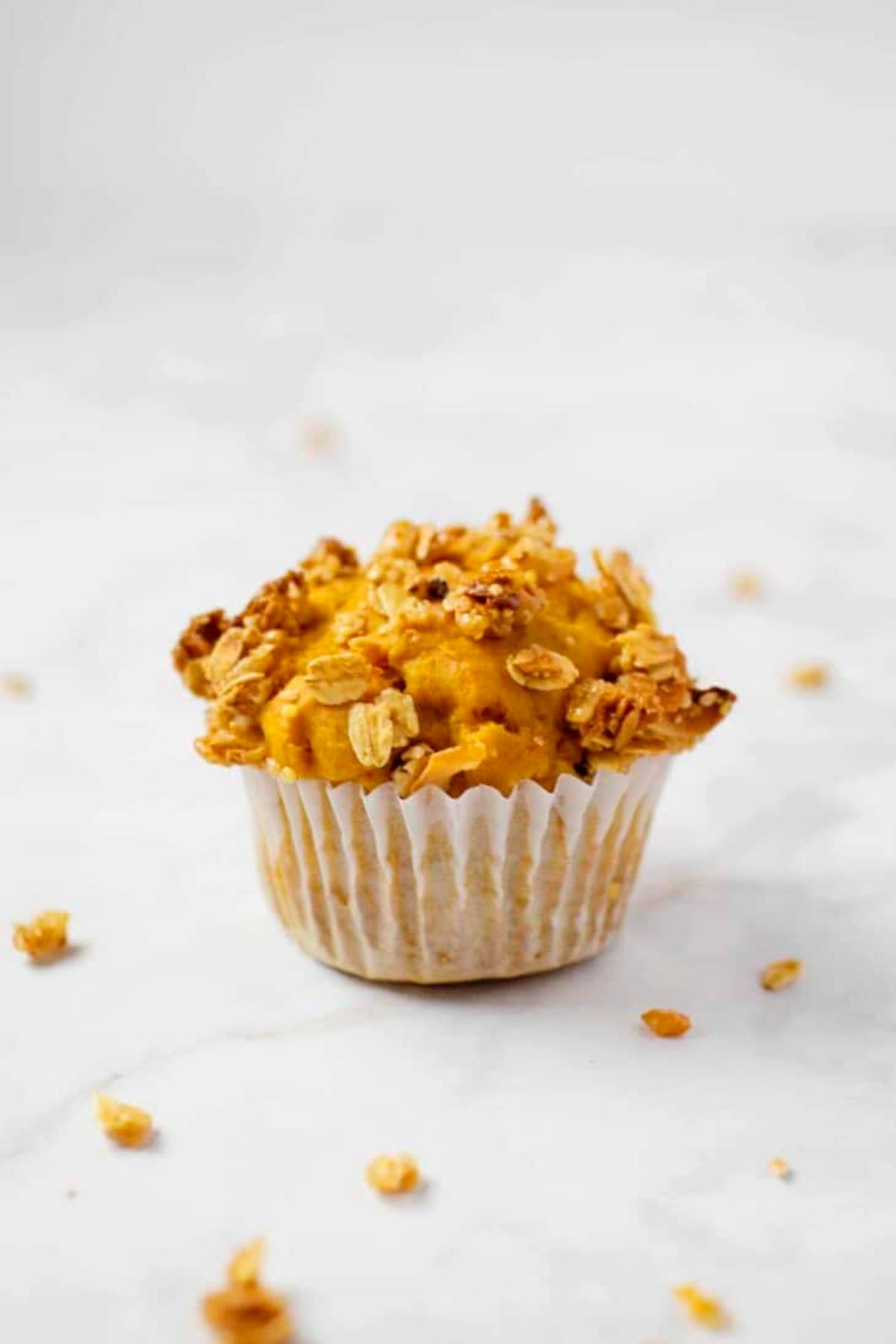 Delicious pumpkin breakfast muffin on a countertop.