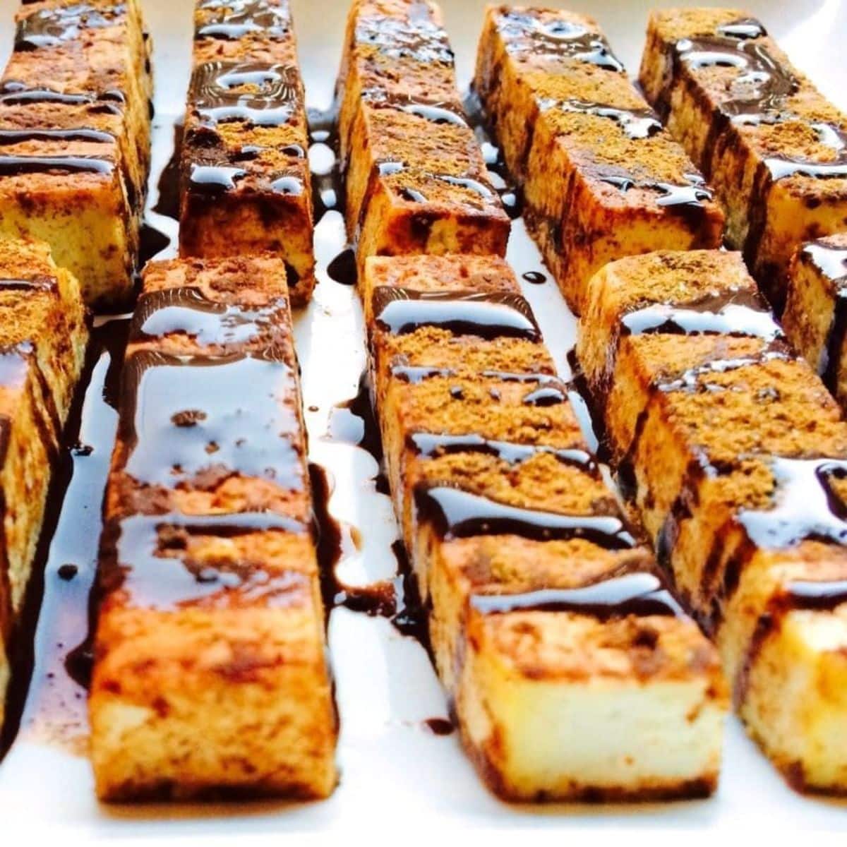 Scrumptious keto cinnamon french tofu sticks on a tray.