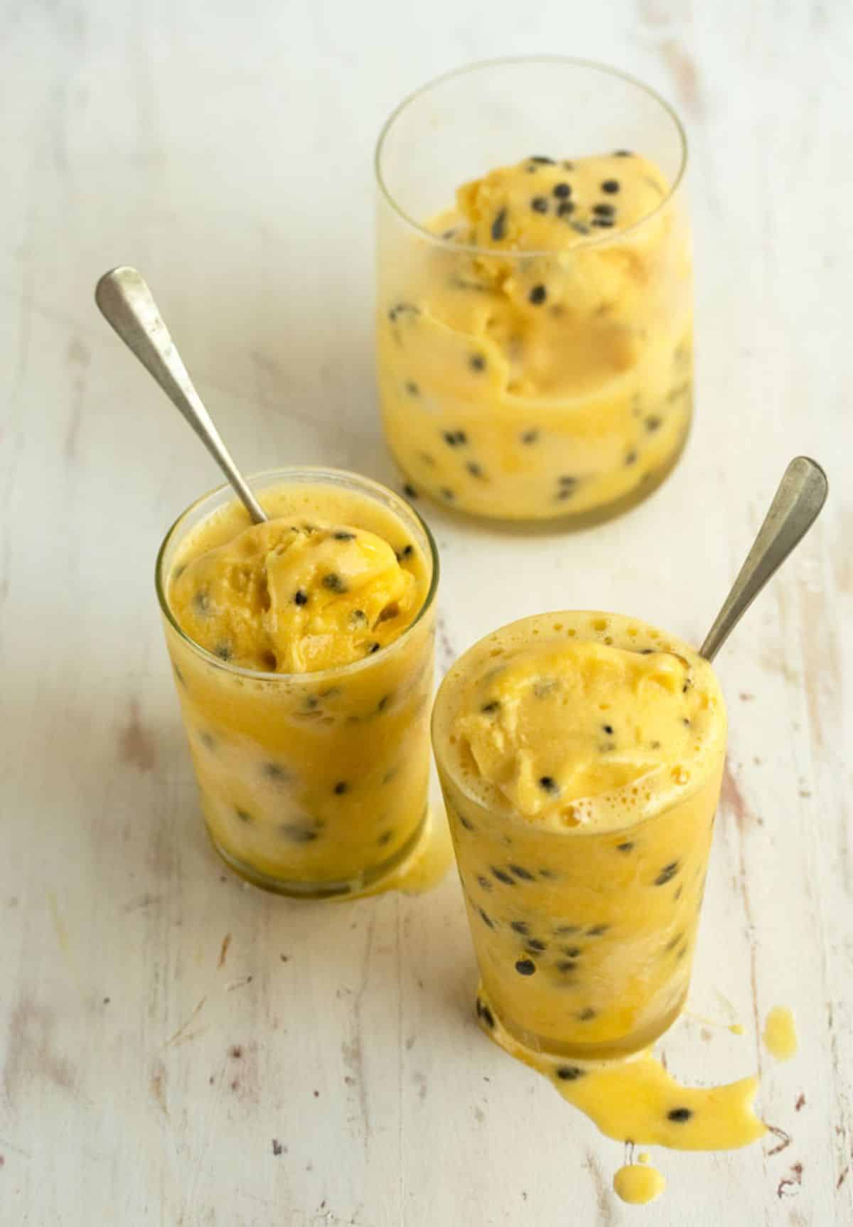 Fresh passion fruit sorbet in glass cups.
