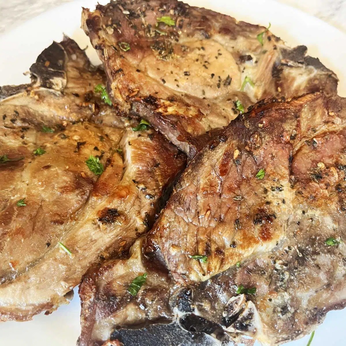 Air fryer pork chops with garlic & herbs