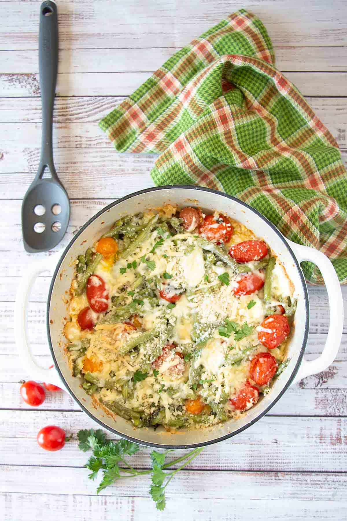 Cheesy green bean casserole with cherry tomatoes