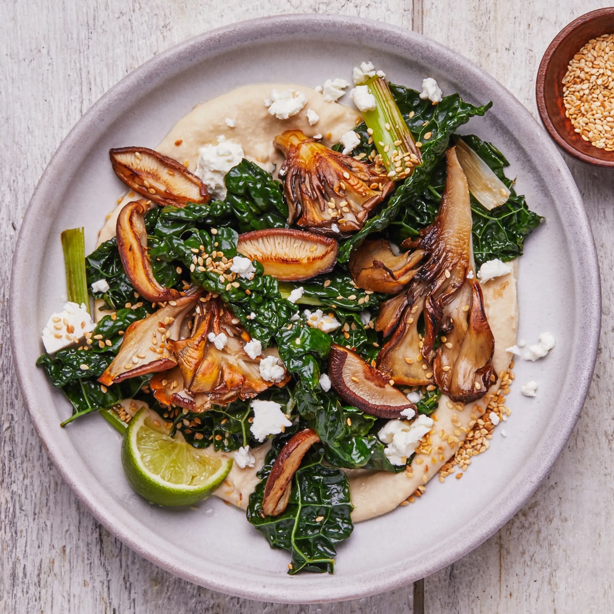 Crispy mushrooms with creamy white beans and kale