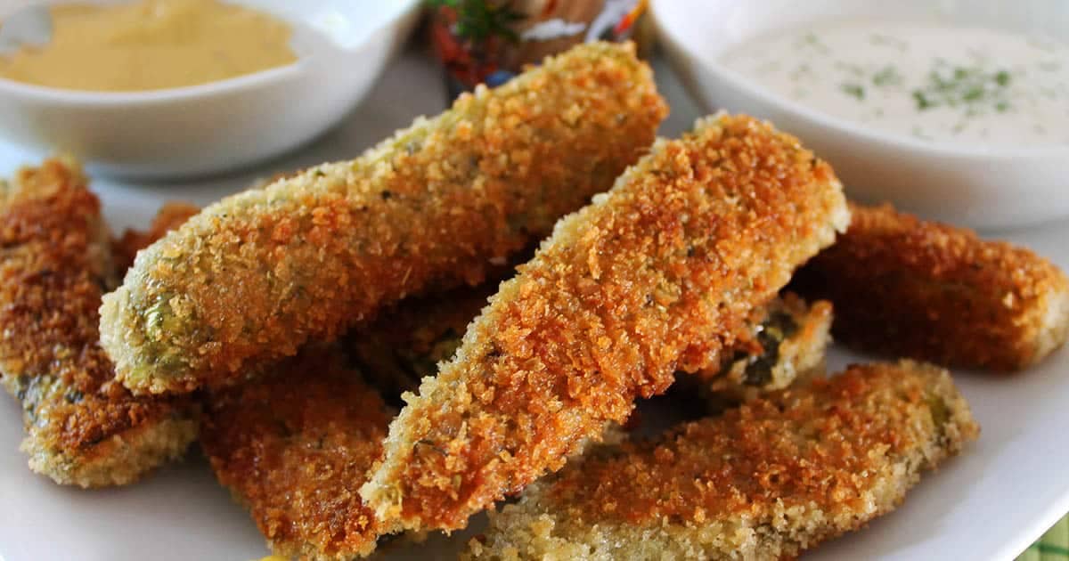Crunchy breaded fried pickles in an air fryer with oregano