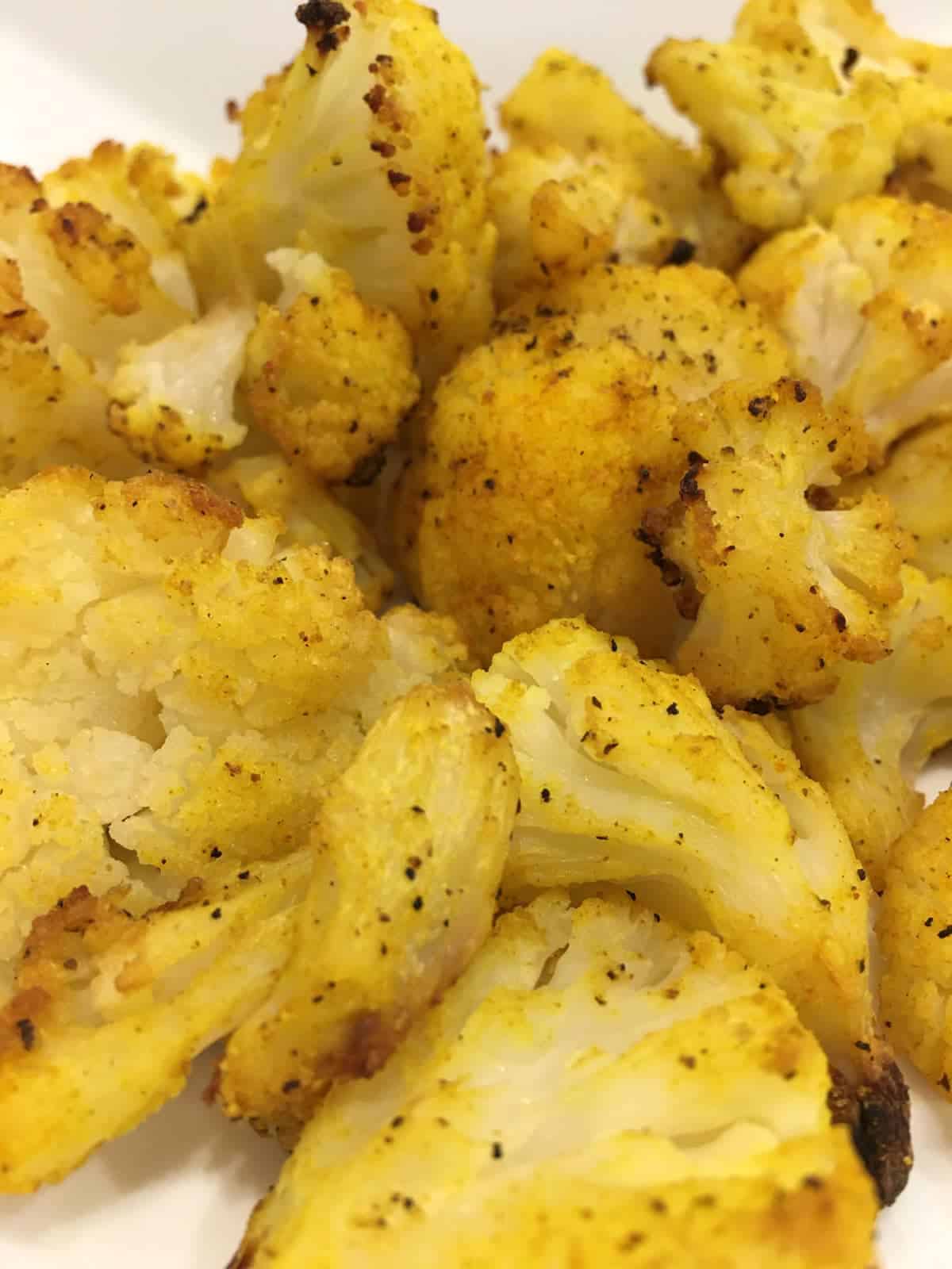 Oven roasted frozen cauliflower florets with turmeric lemon
