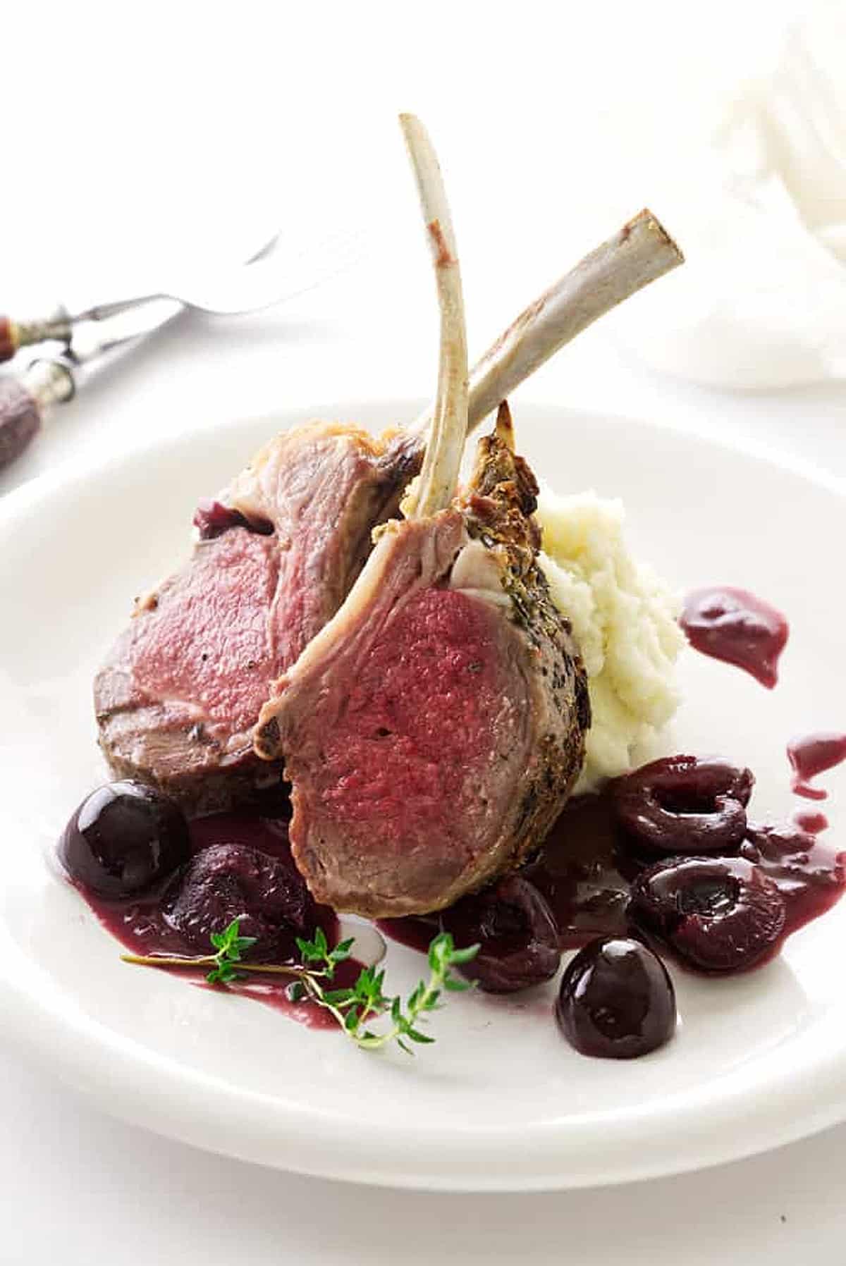 Roasted rack of lamb with red wine cherry sauce