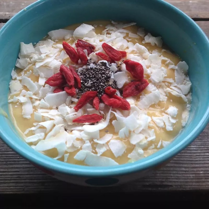 Smoothie bowl with mango and coconut