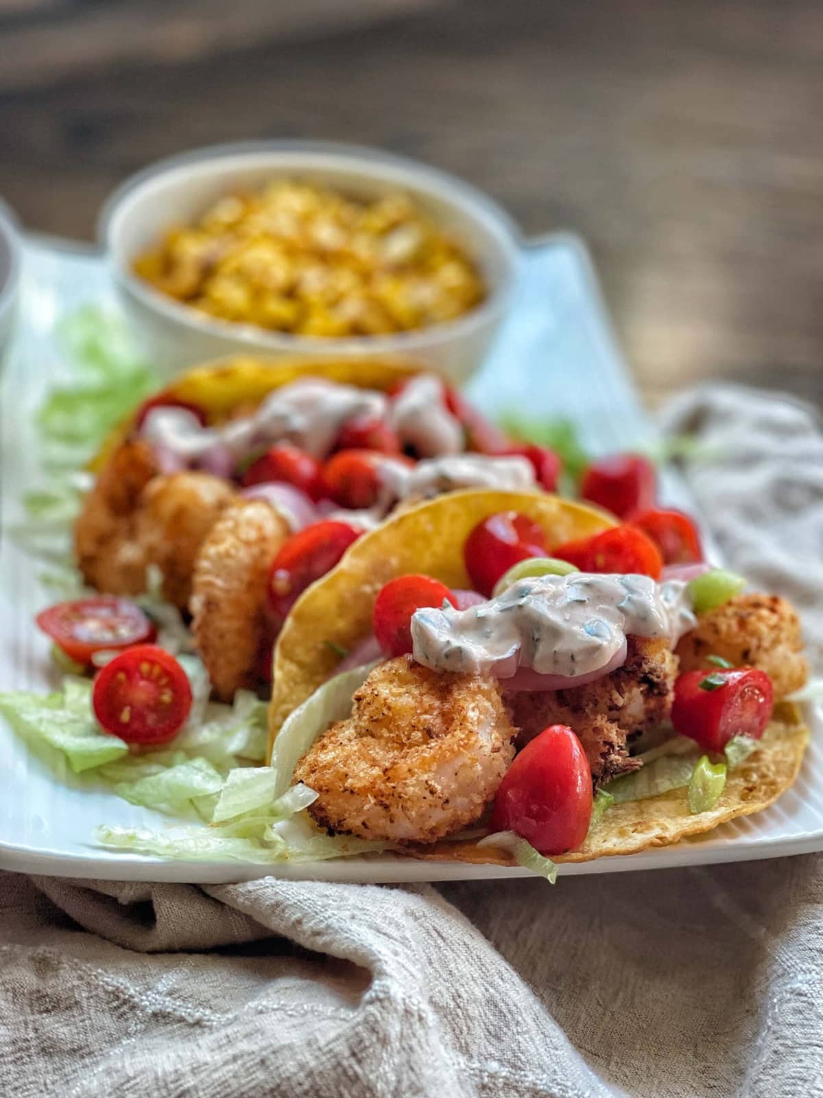 Air fried crispy shrimp tacos with sriracha lime crema