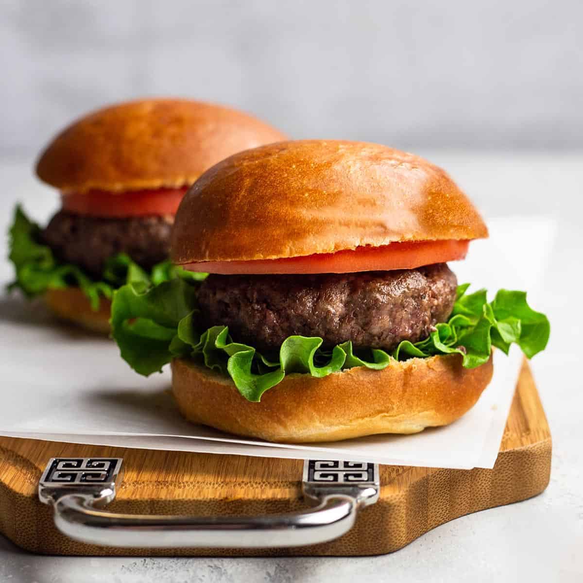 Air fryer burgers with garlic butter spread
