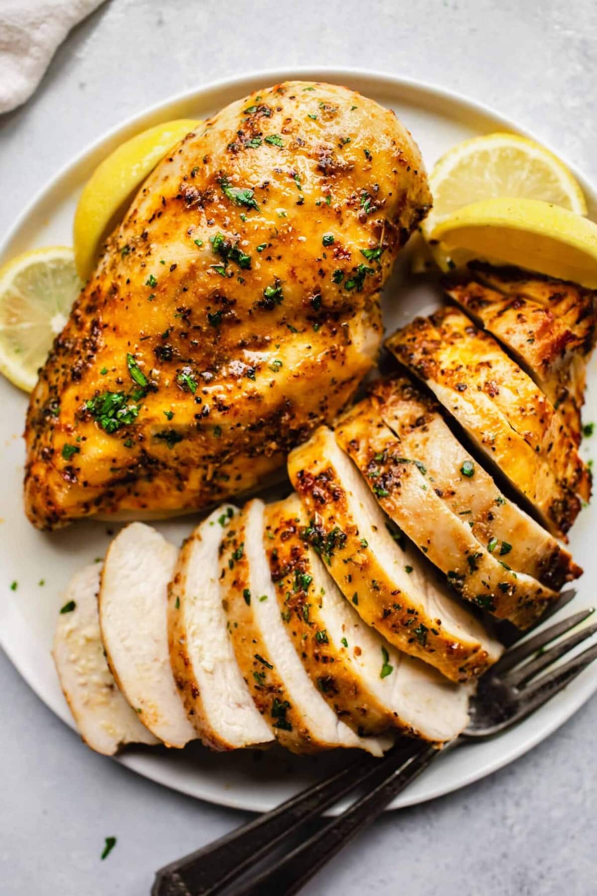 Air fryer chicken breasts seasoned with herbs & spices