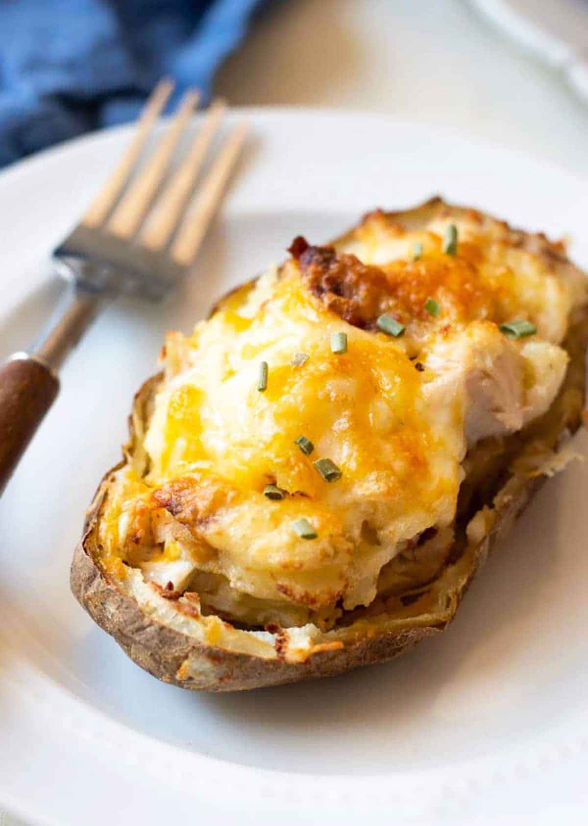 Creamy and loaded air fryer twice baked potatoes