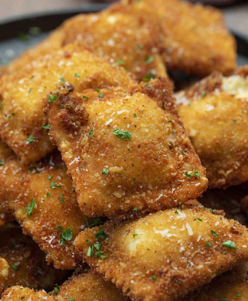 Crispy fried ravioli with parmesan cheese and parsley