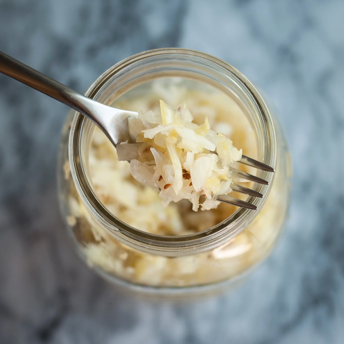 Homemade sauerkraut in a mason jar