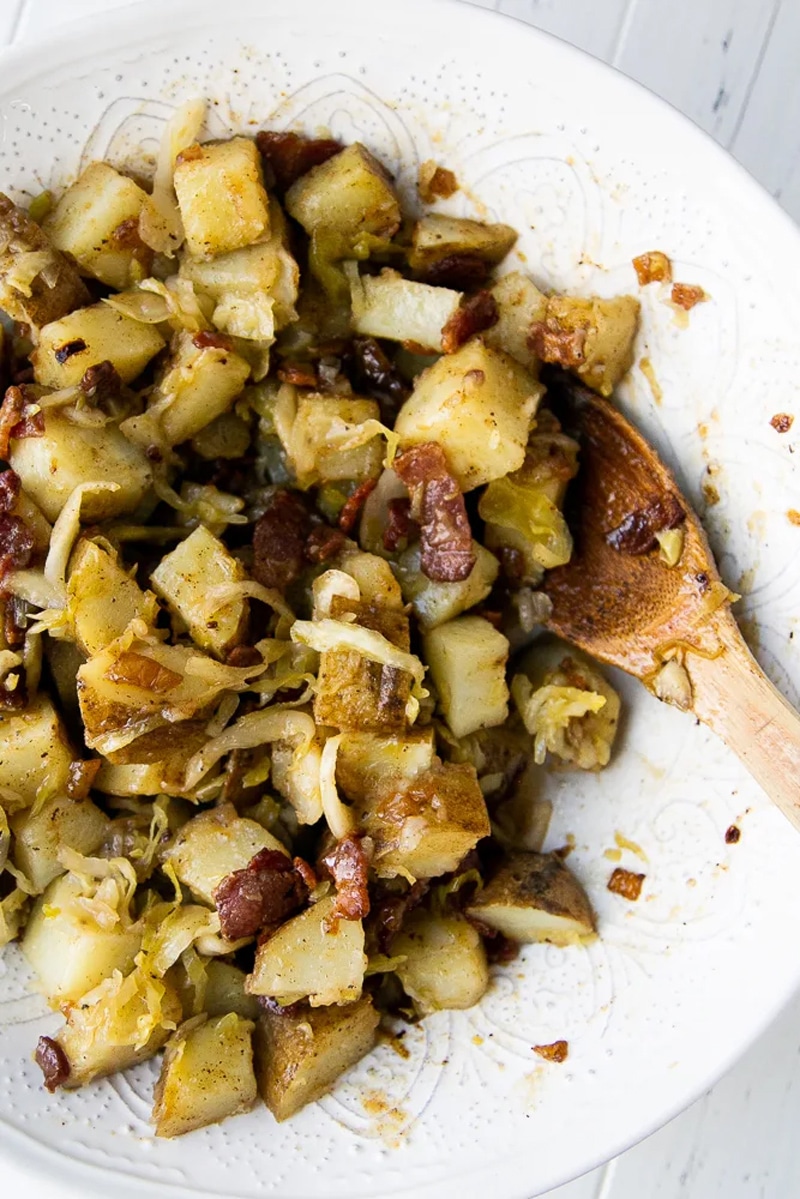 Hot german potatoes and sauerkraut with bacon dressing