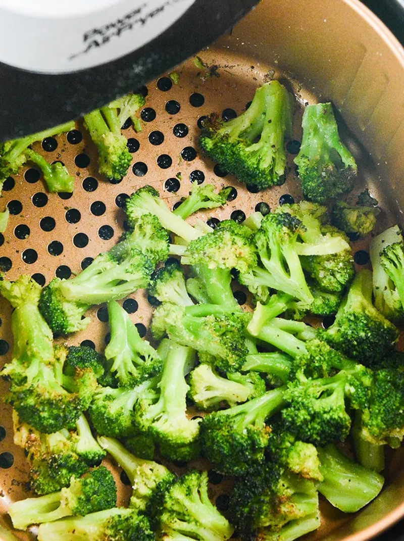 Roasted frozen broccoli in an air fryer with bacon fat