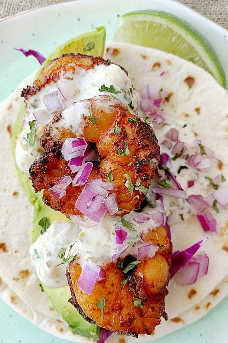 Air fryer shrimp tacos with green salsa and sour cream sauce
